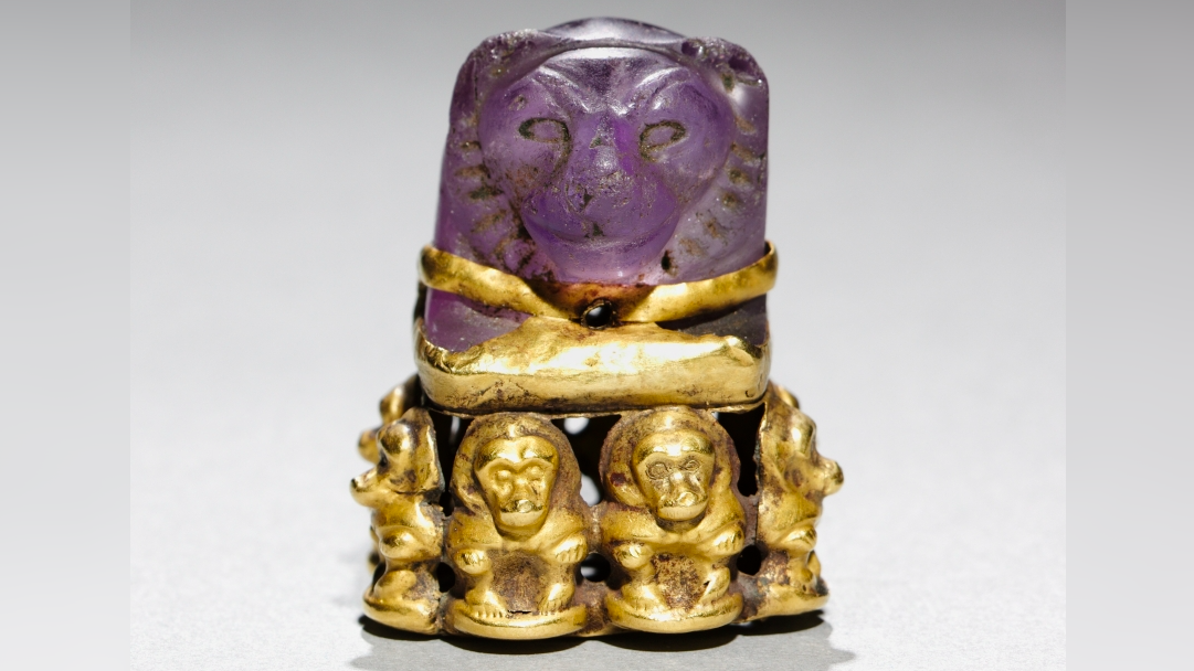 Lion’s head pendant: An ancient Egyptian board game piece that was later repurposed into a magical religious object with baboons