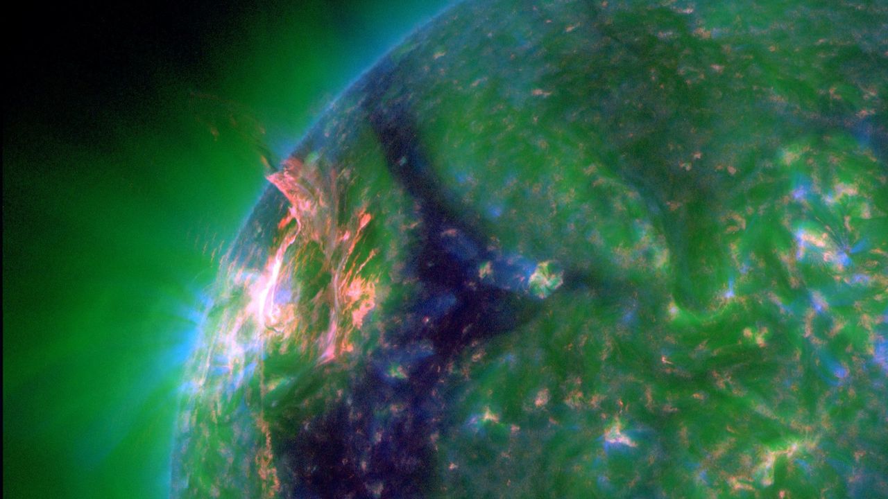 Eruption blows hole in sun’s atmosphere, unleashing solar flare and potentially triggering northern lights