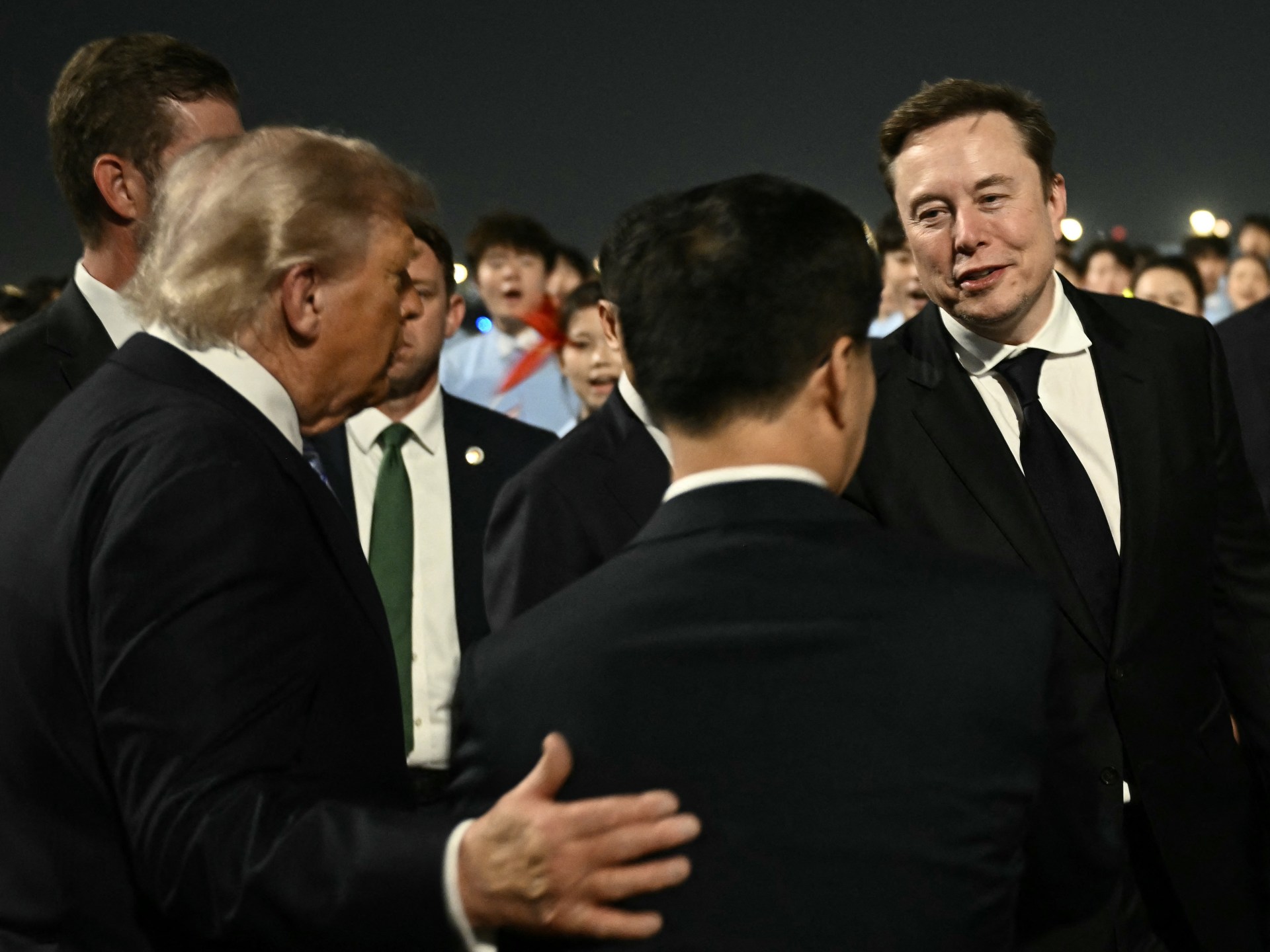 Who are the US CEOs in China with Trump, and what’s in it for them?