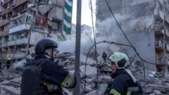 Ukraine rescuers pull dead from rubble of Kyiv flats after massive Russian strikes