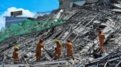 One killed and many feared trapped under collapsed building in Philippines