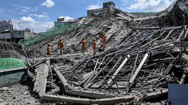 21 people trapped under rubble after deadly building collapse in Philippines