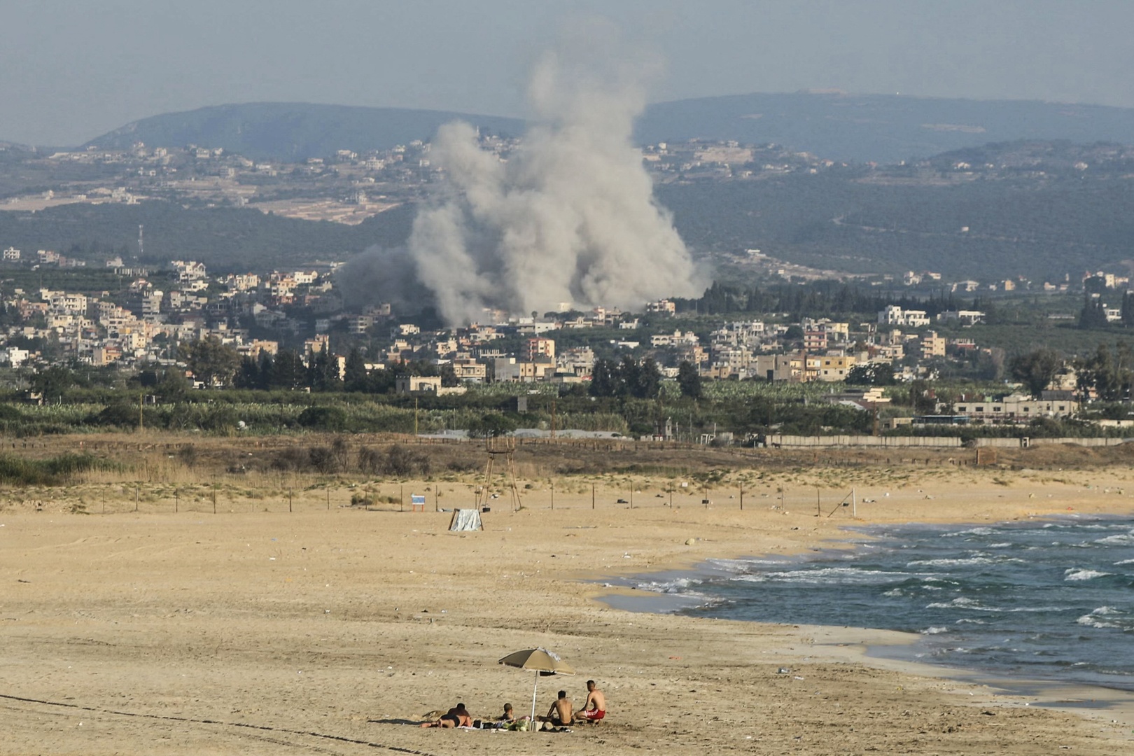Israel continues strikes on Lebanon despite halting attacks on Iran