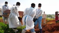 ‘I buried my parents one day after the other’ – Ebola mourners learn how to grieve safely