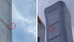 Debris falls after plane hits Beijing’s tallest building