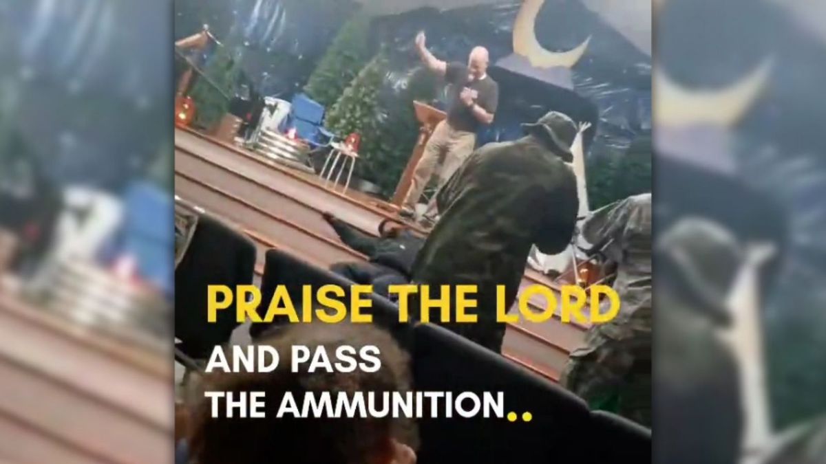 Does video show children watching mock execution at church?