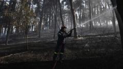 Firefighters struggle to contain deadly Greek wildfire