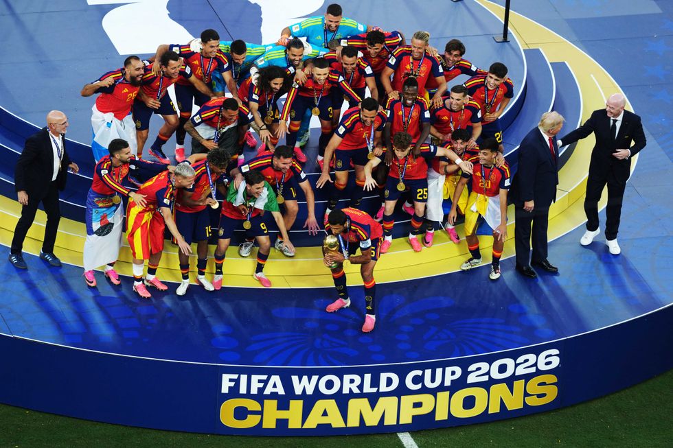 Confused Trump wanders through Spain’s World Cup celebration photo