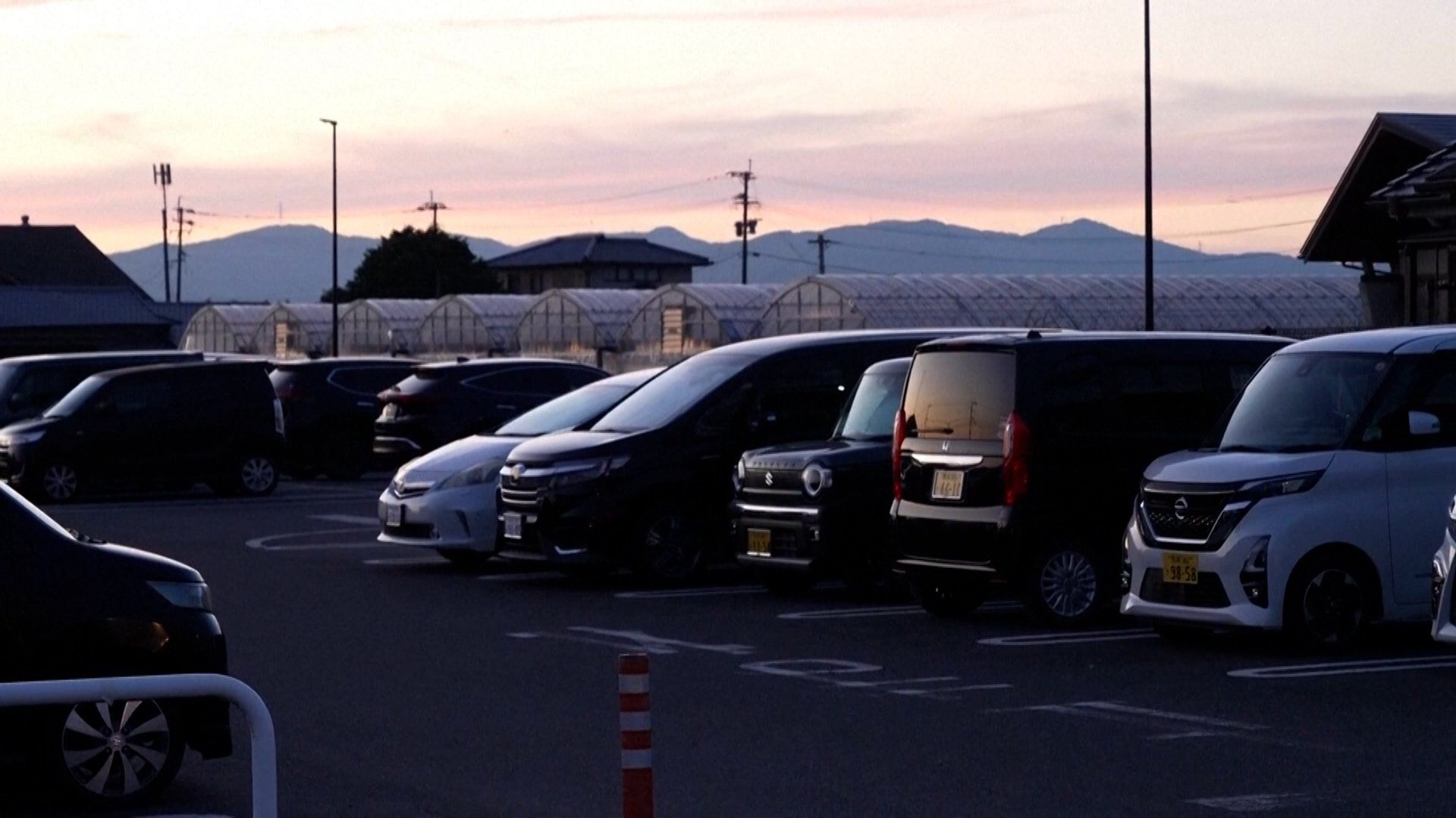 Families sleep in cars after homes destroyed in Japan earthquake