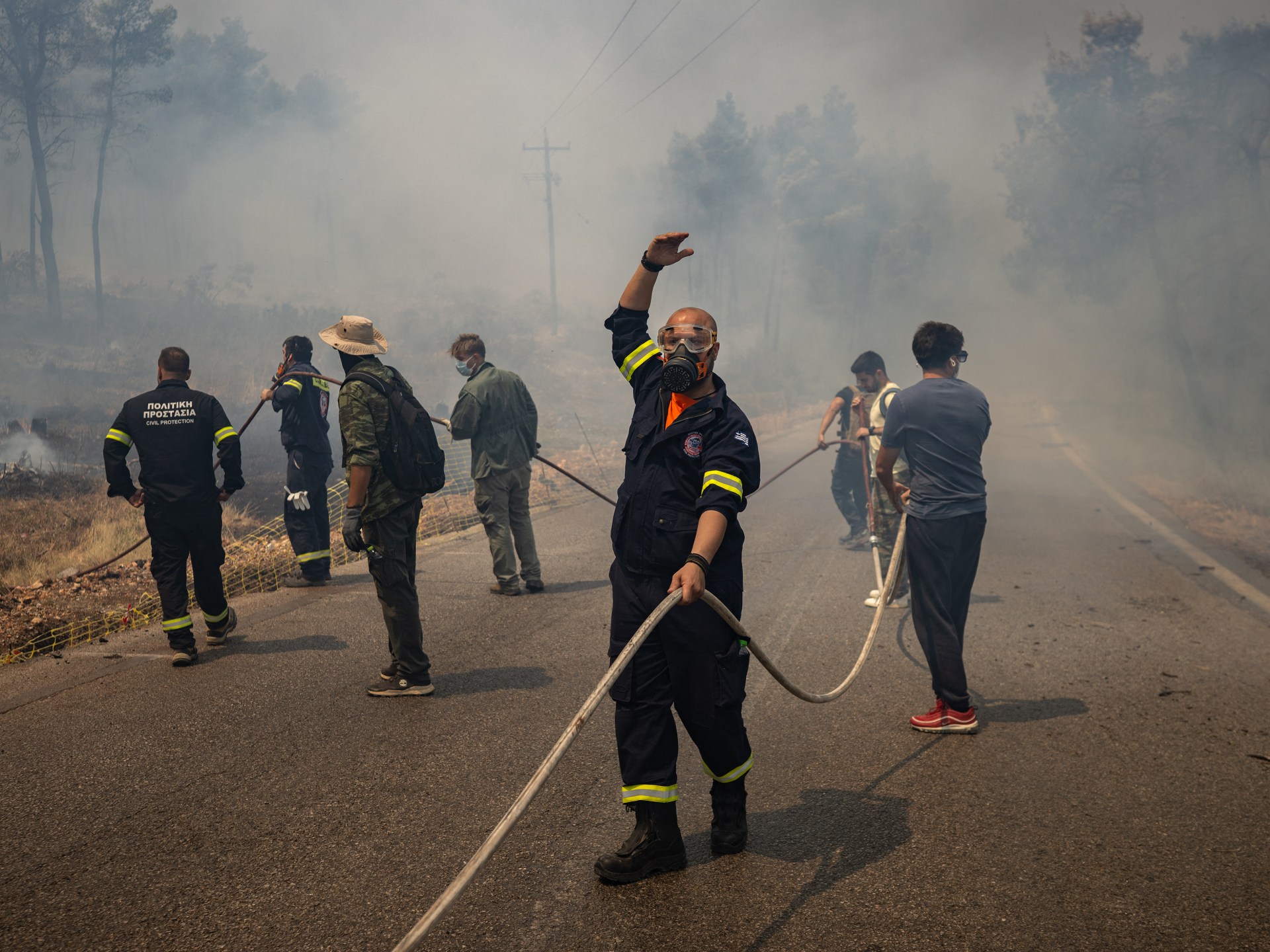 Firefighting helicopters collide near Athens as Greece battles wildfires