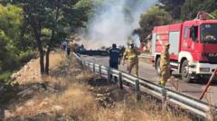 Two crew killed after firefighting helicopters collide in Greece, as British pilot survives