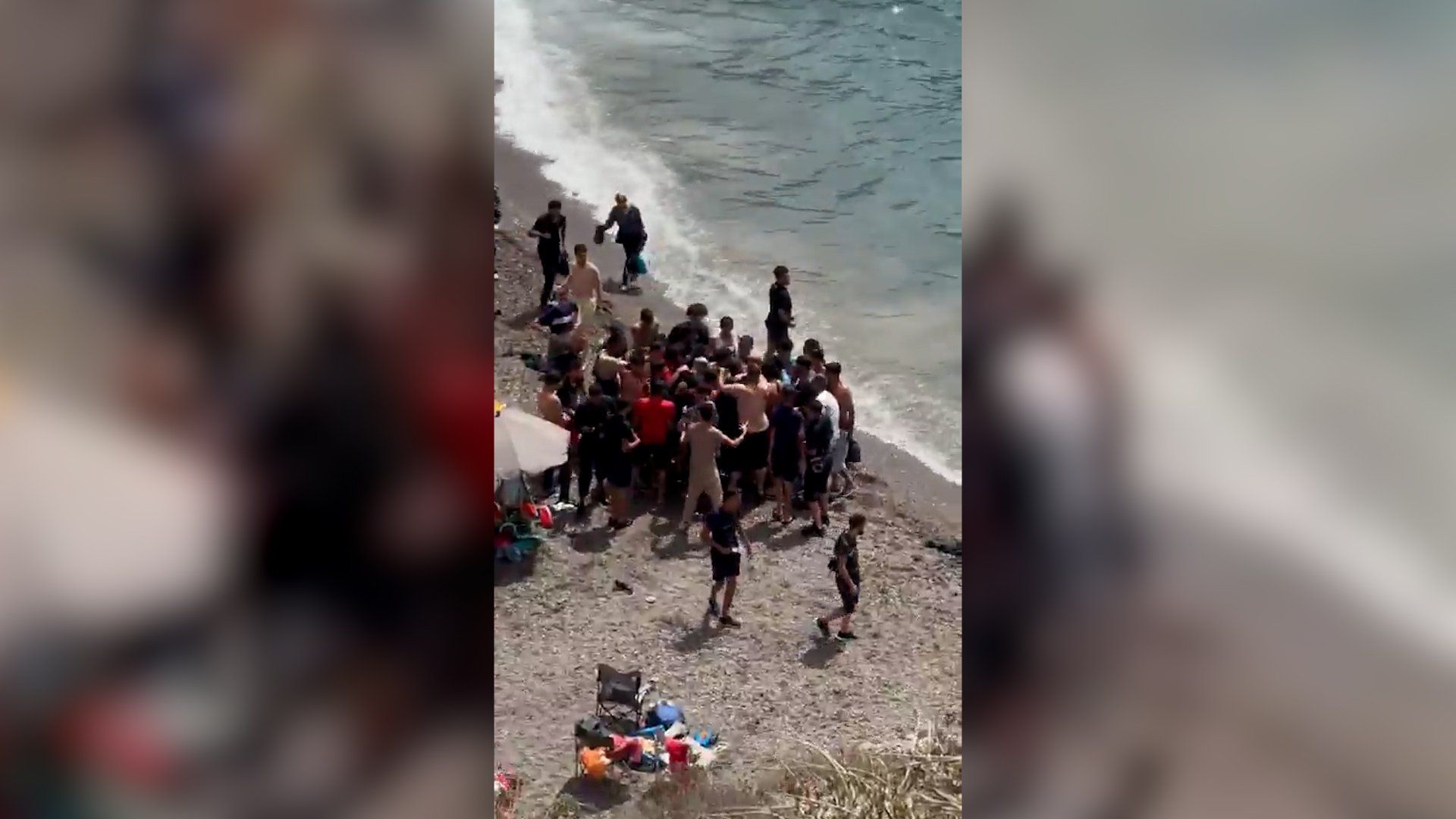Dozens of migrants land on Spanish coast surprising beachgoers