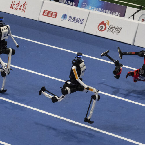 World humanoid robot games show runners breaking records, bursting into flames