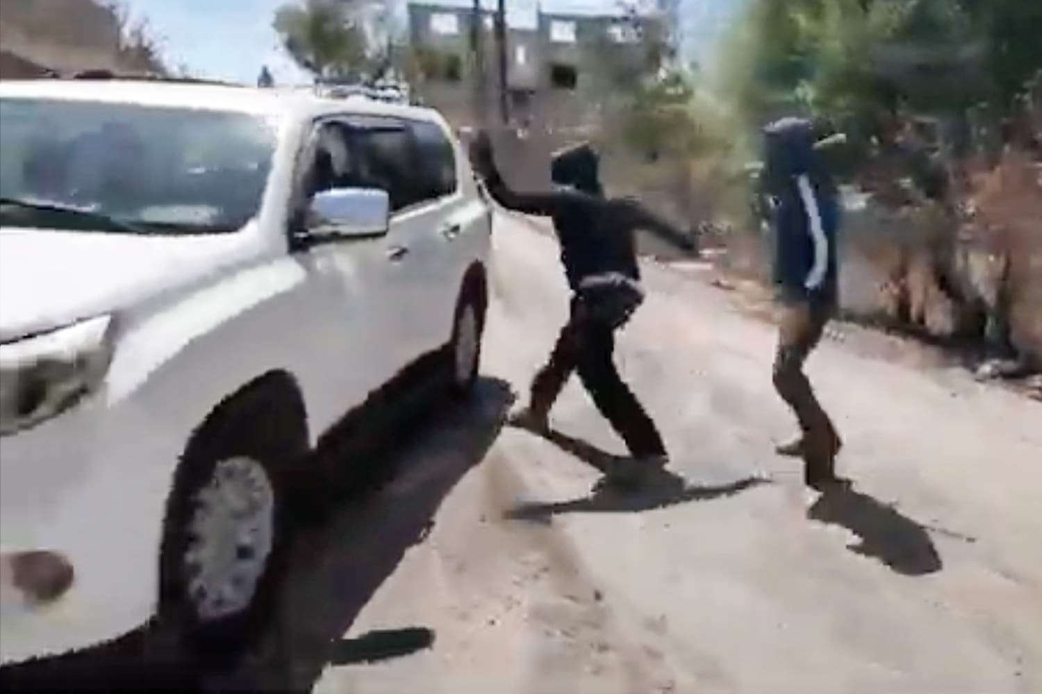 Palestinian woman and NBC News team attacked by masked Israeli settlers in West Bank