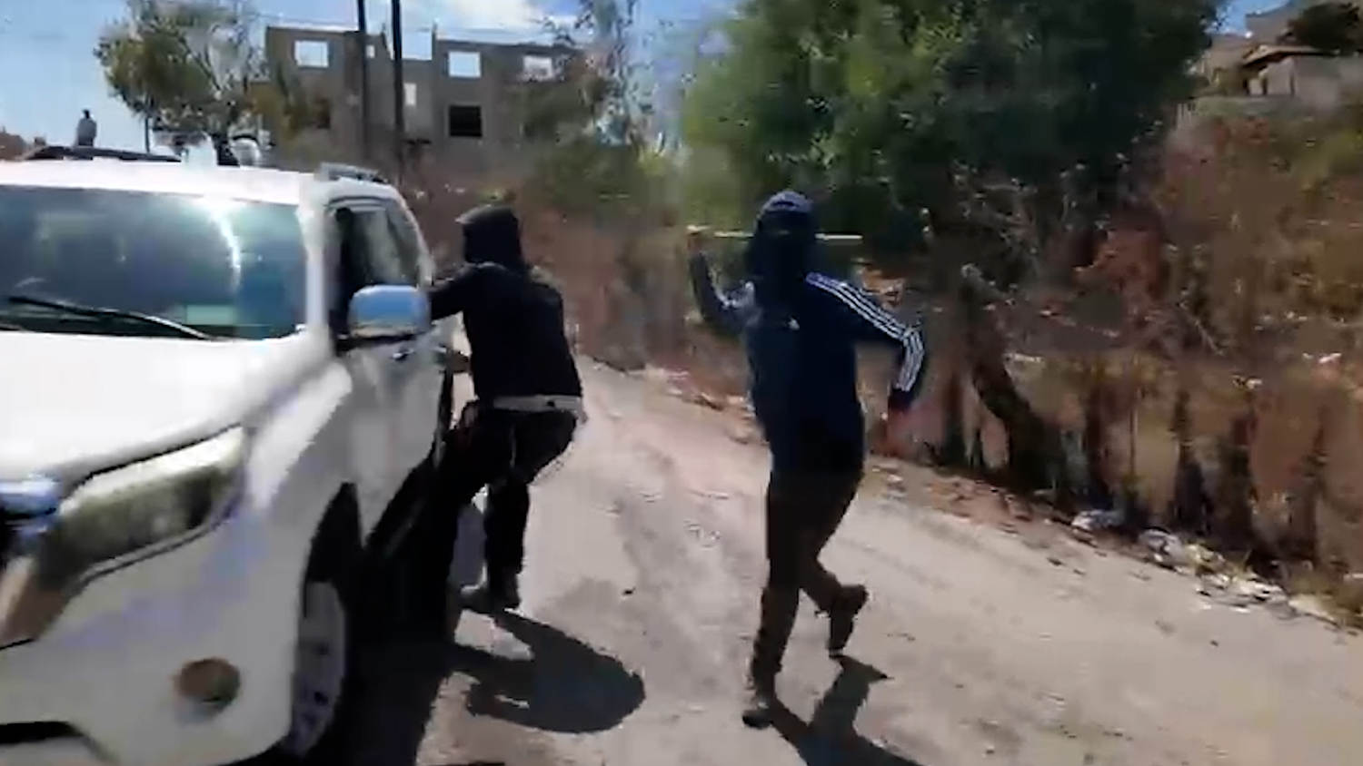 Palestinian woman and NBC News team attacked by masked Israeli settlers