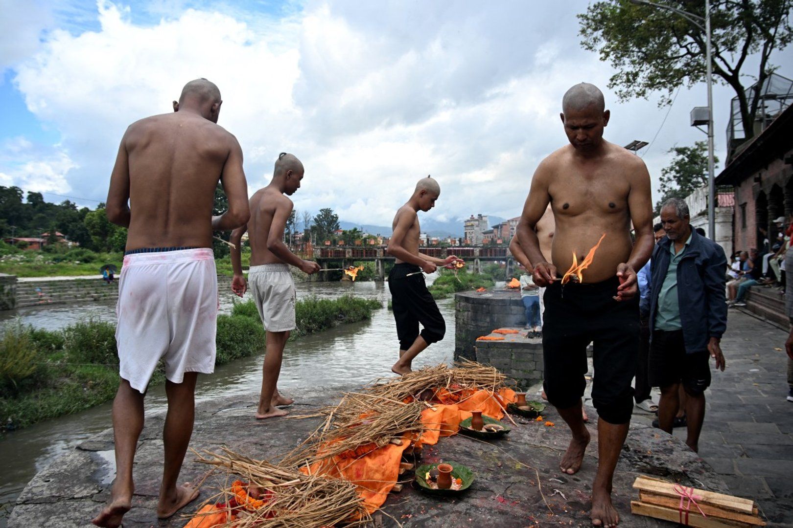 Nepal families hold symbolic funerals, thousands still missing