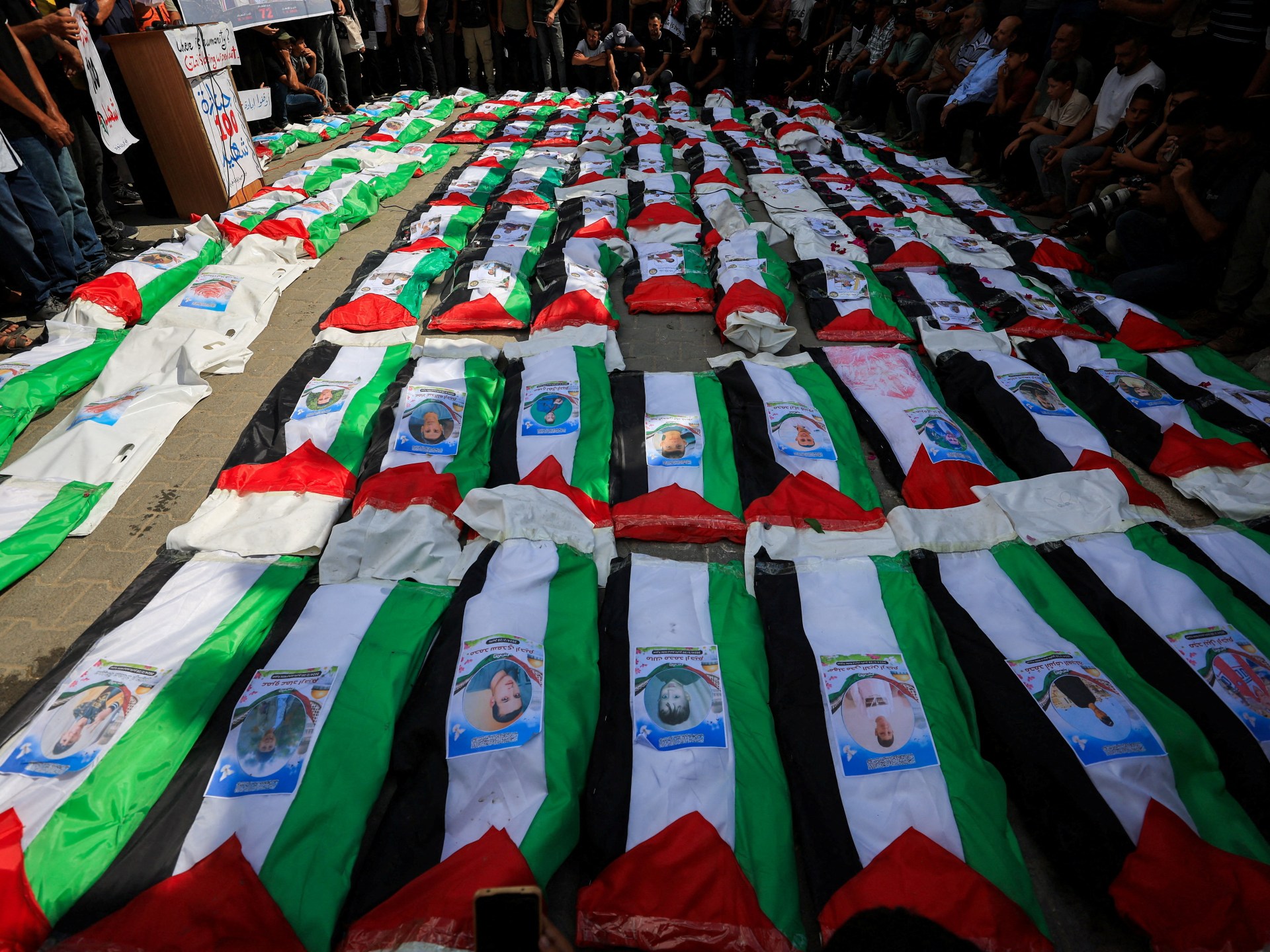 Photos: Gaza holds funeral for 100 Palestinians recovered from rubble