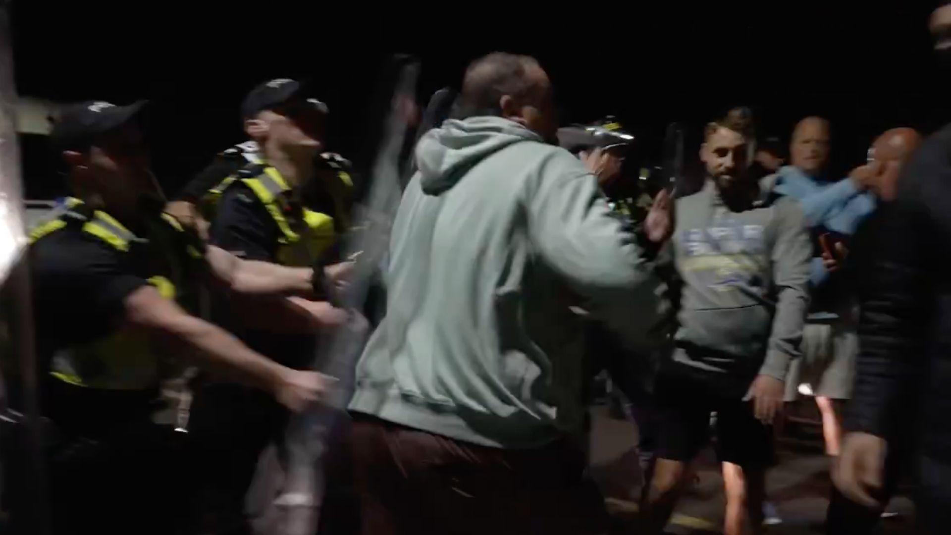Anti-immigration protesters clash with police in UK after boat arrival