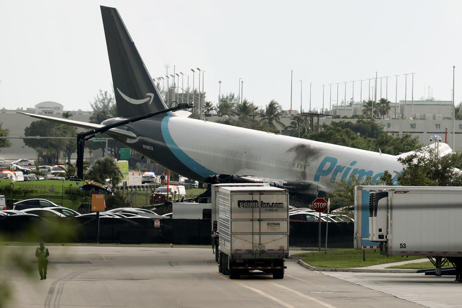 Five dead after Amazon-branded cargo plane overruns runway at Miami airport, striking multiple vehicles