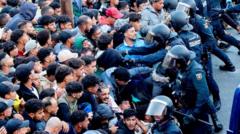 Shots heard as police start moving migrants from Ceuta beaches