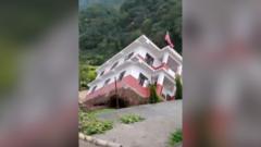 Watch: Moment a government building collapses into a river in Nepal amid floods
