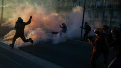 Clashes erupt between police and protesters in Paris